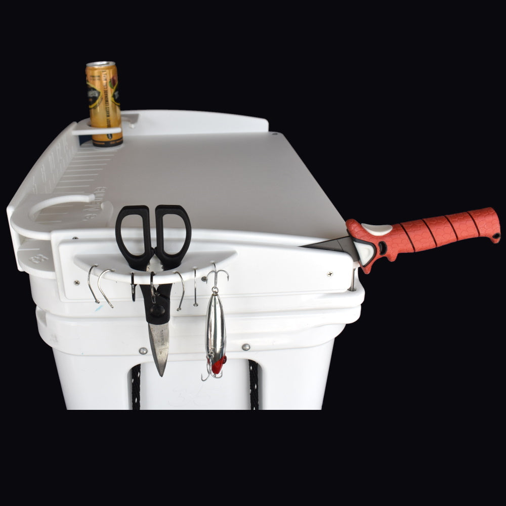 Mangrove Marine’s Yeti Cooler Cutting Board protects your Yeti cooler lid and is available in a standard or deluxe model. The deluxe model features 2 cup holders (also fits cups with handles), a measurement ruler, pliers or scissors holder, knife holder with sheath as well as multiple holes for hanging hooks and lures.