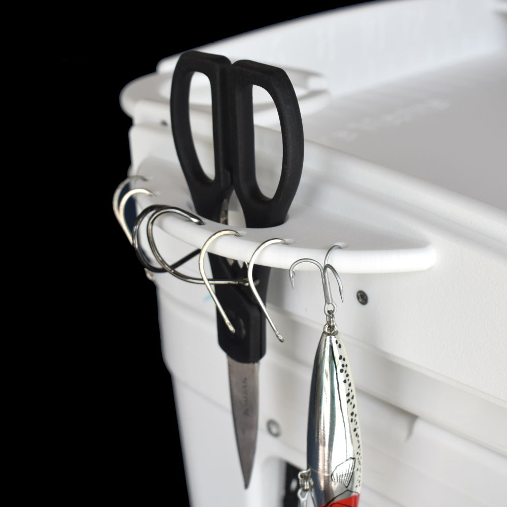 Mangrove Marine’s Yeti Cooler Cutting Board protects your Yeti cooler lid and is available in a standard or deluxe model. The deluxe model features 2 cup holders (also fits cups with handles), a measurement ruler, pliers or scissors holder, knife holder with sheath as well as multiple holes for hanging hooks and lures.