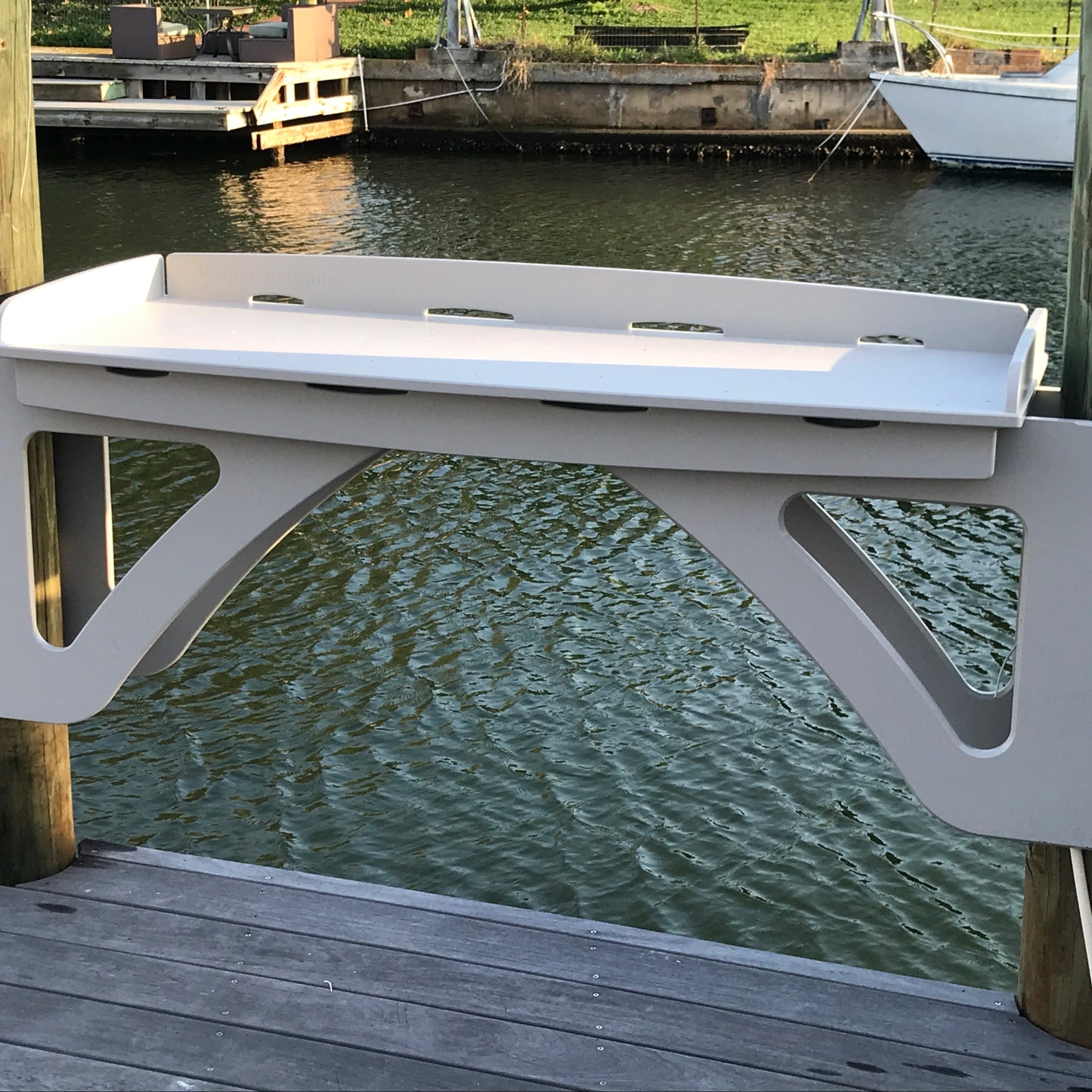 Mangrove Marine features the "no drill", piling mounted Dock Side Cleaning and Fillet Table with our innovative cantilever design. Select from a one pole mount or two pole mount configuration. Our exclusive piling mounted design saves dock space and keeps the mess away with back side drain holes to clean your fish. Shown is a 2 pole mount version.