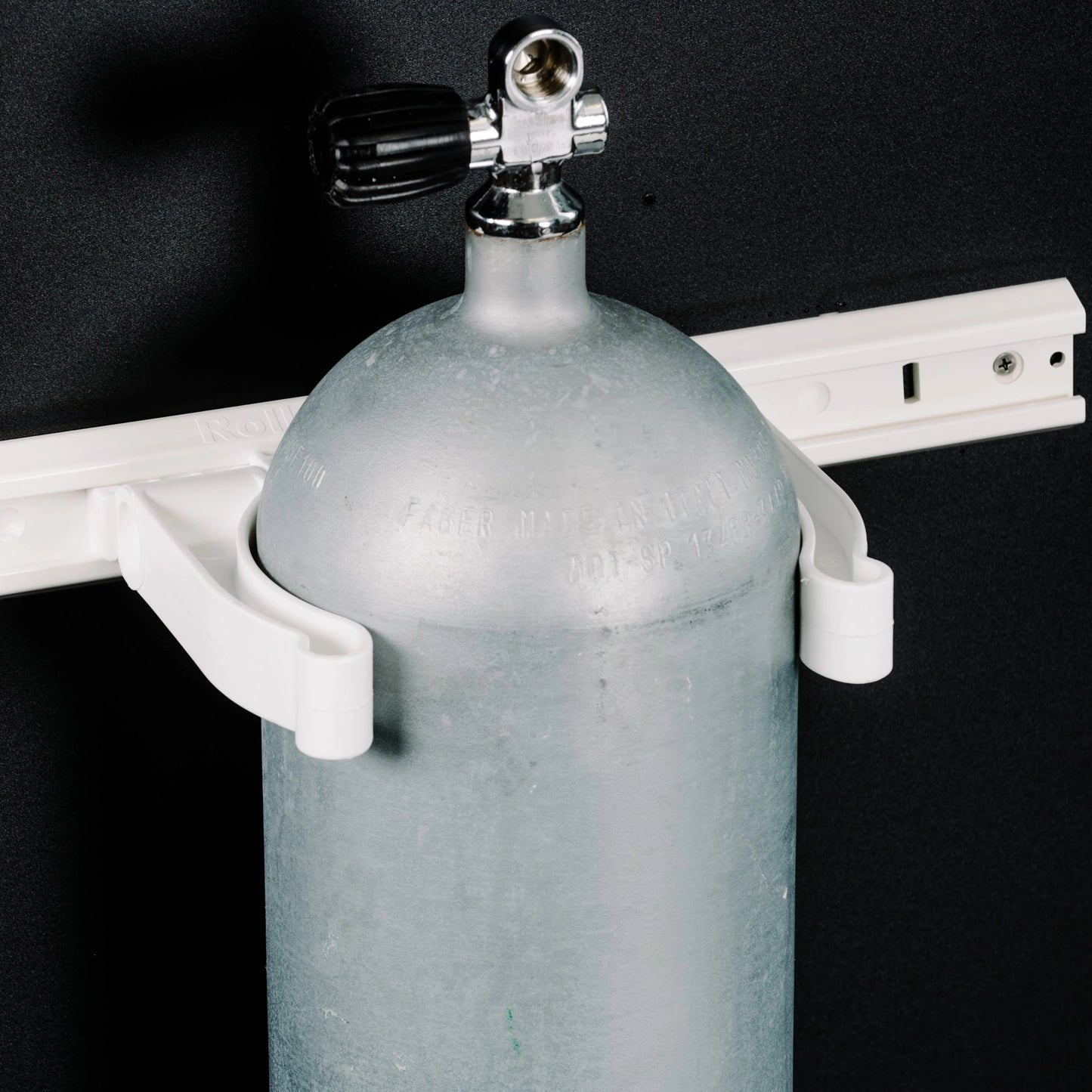 Tired of your scuba tanks rolling around the back of your boat? Store them safe and secure with Roll Control! Designed to be installed in tandem with the Roll Control Aluminum Track. Holds tanks vertically against the side of your boat or truck to save space. Rope tie down holes for increased stability or security. Perfect for easy access and transport of your rigged and ready diving gear.